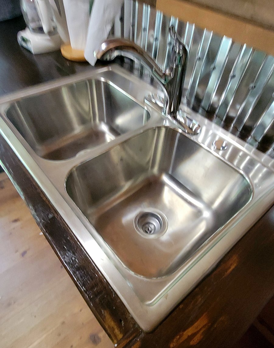 Who would have guessed a cabin this cozy would offer a double sink? What an advantage when dishes need attention!