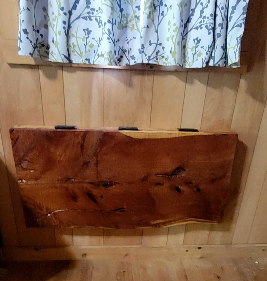 And look! Your spacesaving fold-out live edge cedar dining table matches the nightstands! The table is the standard 30-inch height with dimensions of 22x42 inches, easily accommodating two.