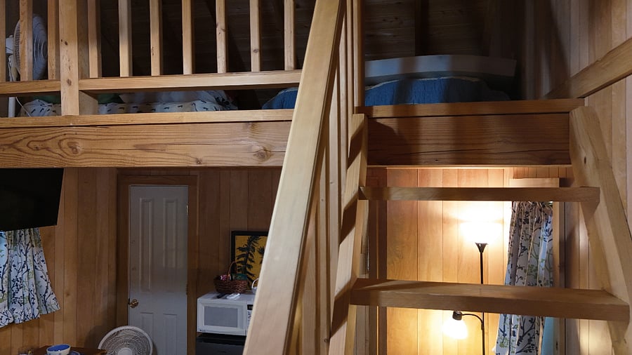 Magnolia Cabin was built from a historic south Louisiana floorplan, which means the Cajun-style steps to the loft are a bit steep. Up there you will find two queen-size floor mattresses, fully dressed with linens and pillows.