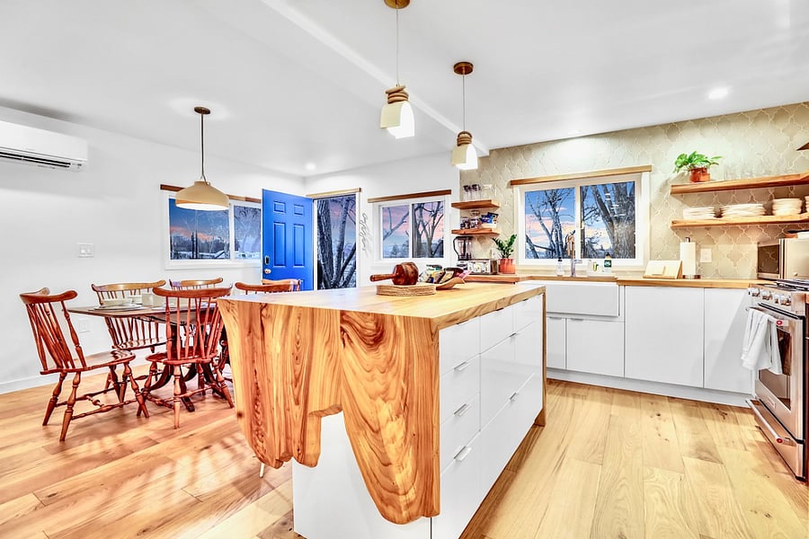 Hand-made kitchen tiles, wood counters and shelves from trees that lived their full natural lives on property, and white oak wood accents.
