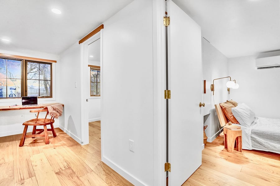 2nd floor with bedrooms, bathroom, work desk, & reading nook.