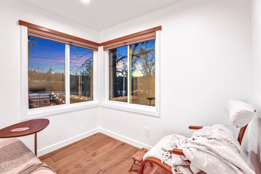 Room with a view! Complete with antique mcm lounger, foot rest, and top town bottom up blackout blinds.