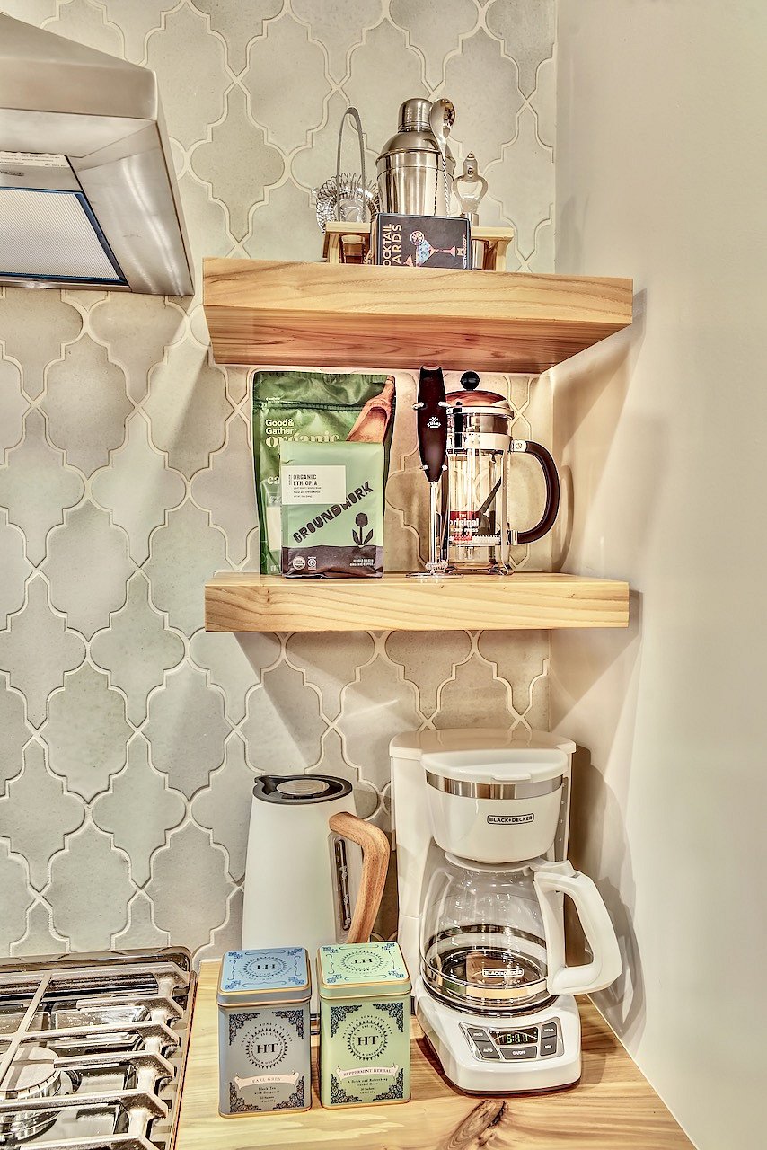 Coffee & tea fixings. Including programable coffee machine, french press, electric milk frother, hand frother/mixer, and kettle.