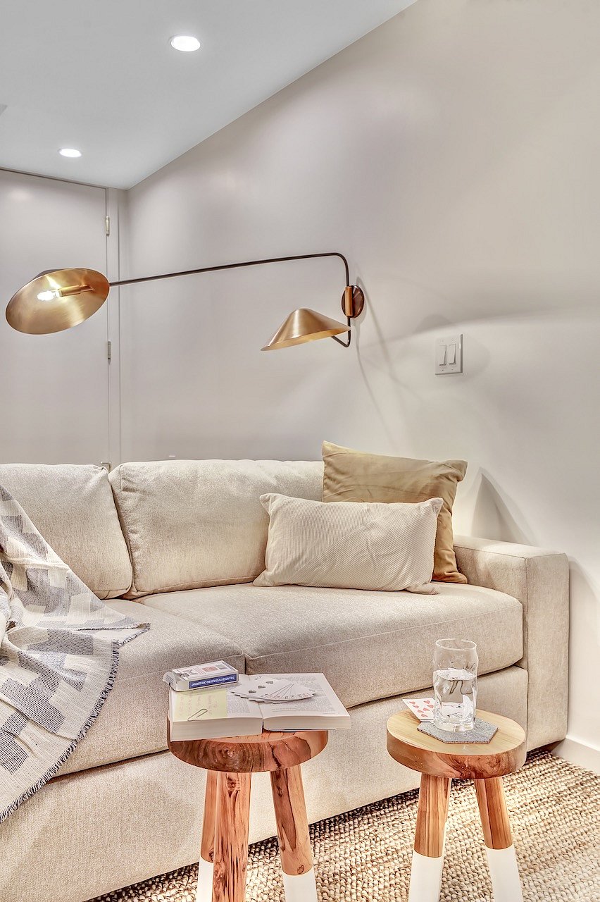West Elm sleeper couch for guests with reading lights.