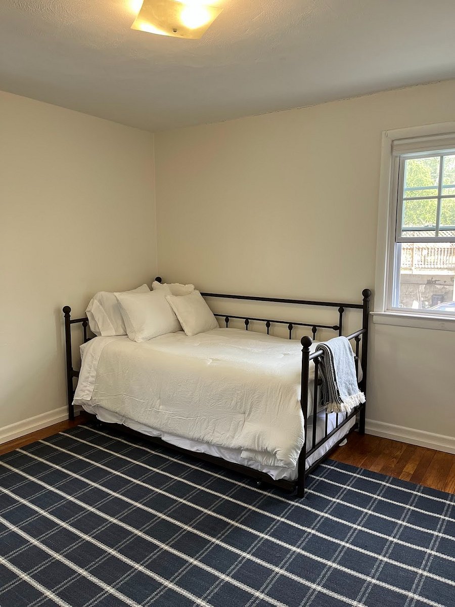 Bedroom with two twin sized beds and and work from home desk and chair