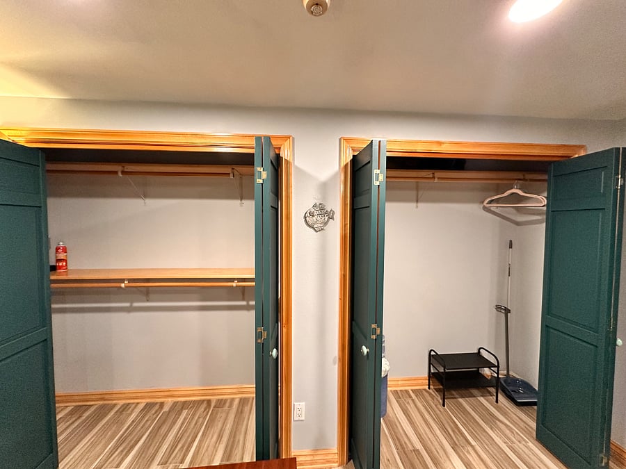 Huge 8 closets with upper and lower hanging space on left; right side upper-only hanging space for longer items.