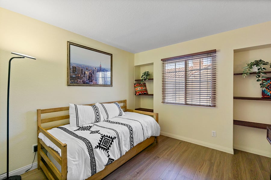 Guest bedroom with twin trundle bed that sleeping two people. includes full closet and small desk.