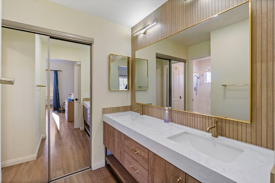 Double vanity just in master bedroom with quartz countertops and 2nd closet.