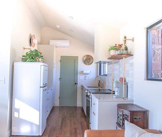 View of kitchen from Living area- furnished with all kitchen essentials