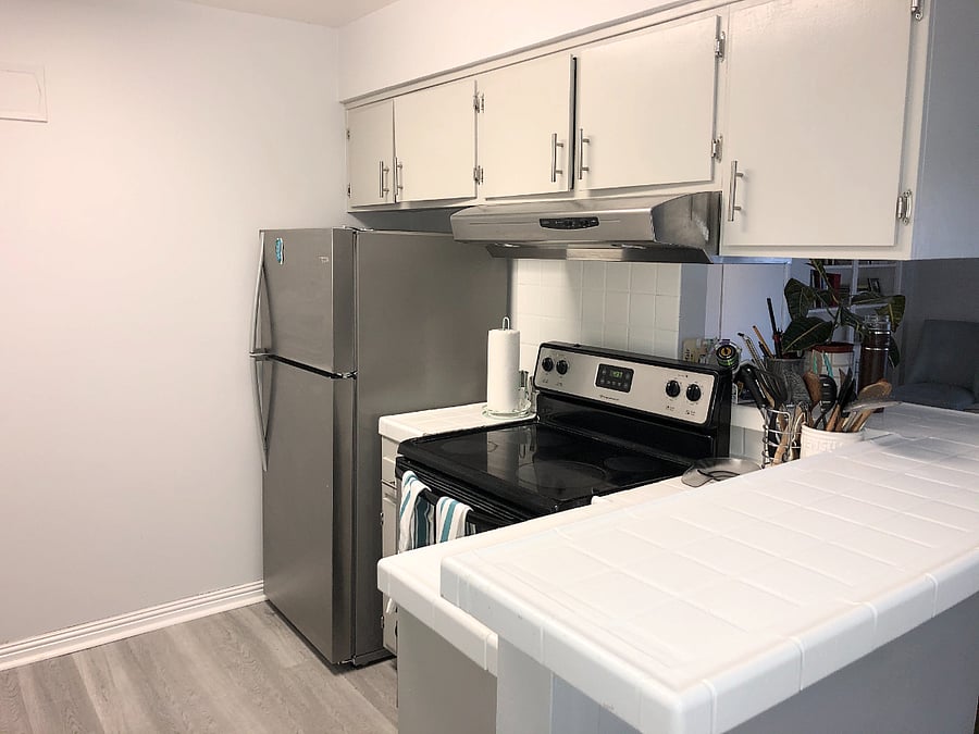 Shared kitchen with stovetop, stainless steel fridge and dishwasher, & new cooking pans