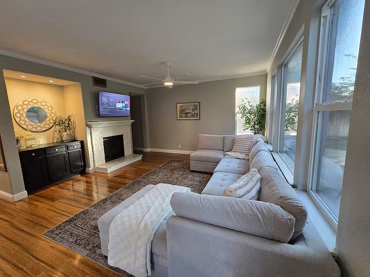 Back living room with comfortable seating and SmartTV.