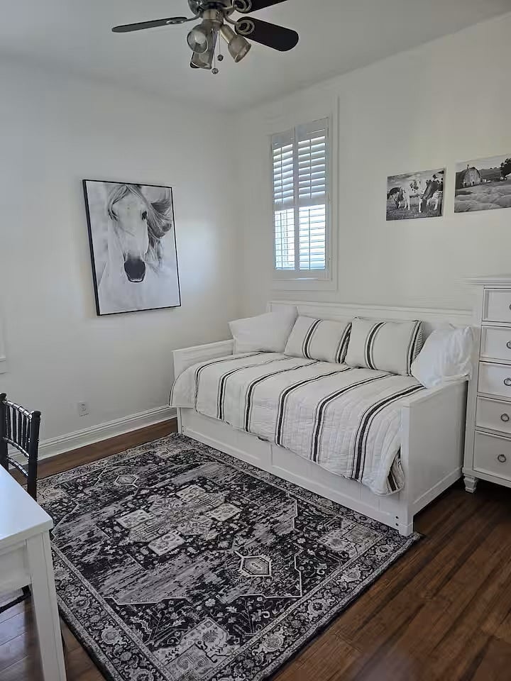 Third bedroom features a daybed with trundle and a desk.