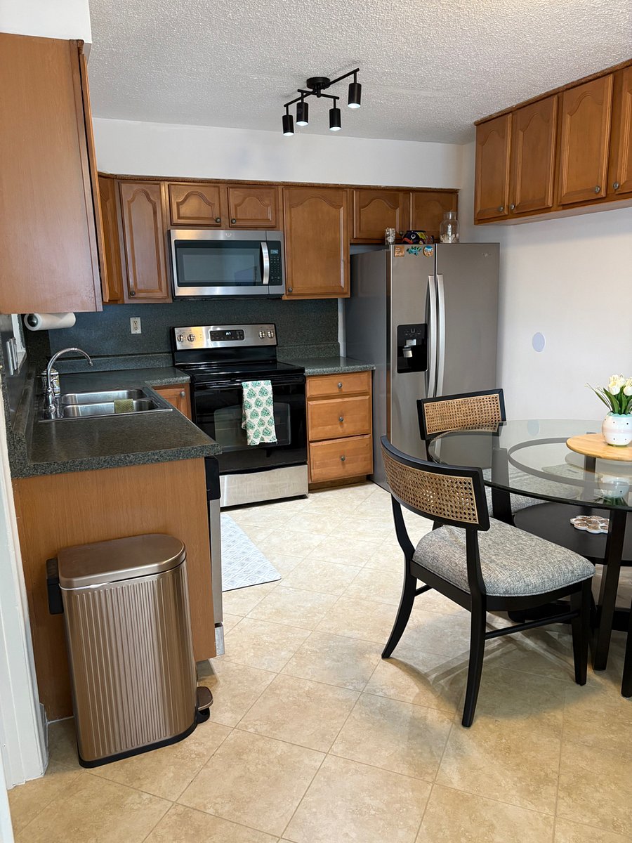 Full kitchen . Table comfortably sits 6.