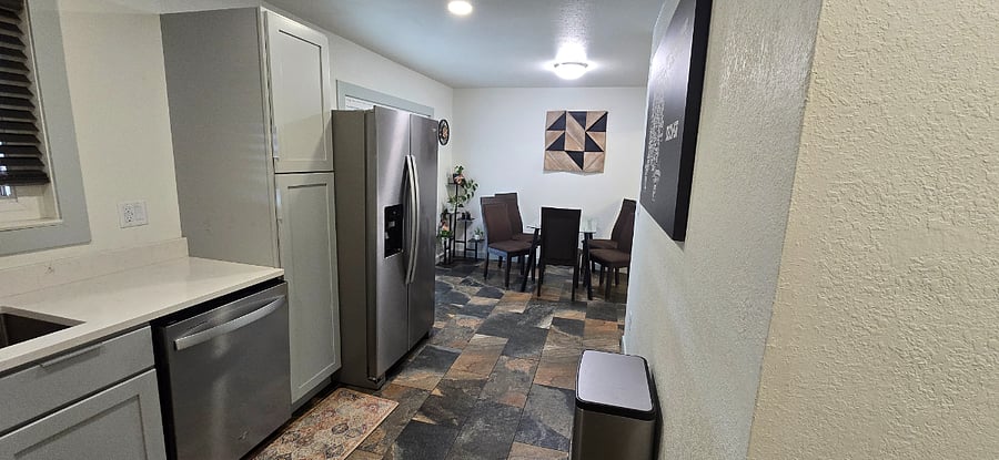 Quartz counter tops, all new Whirlpool stainless steel appliances, gas range, slate tile flooring, fully stocked kitchen with coffee maker, blender, pots and pans, flatware, dishes, towels, etc.