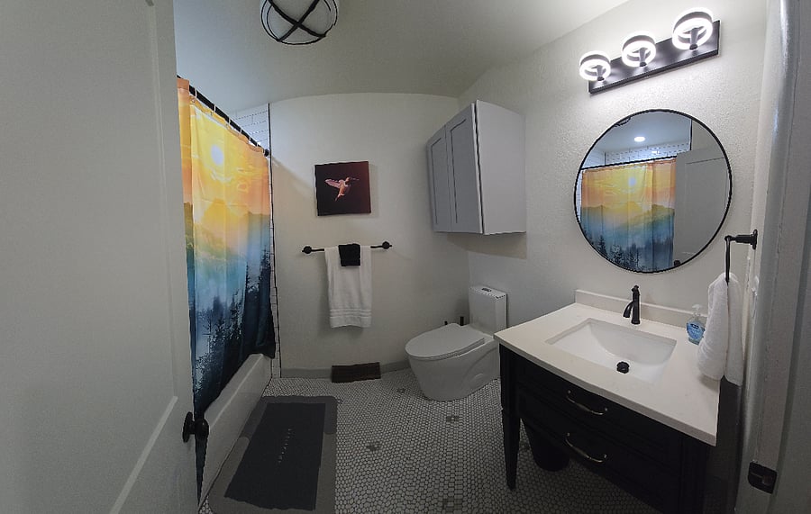 All custom tile, lights, and new toilet.