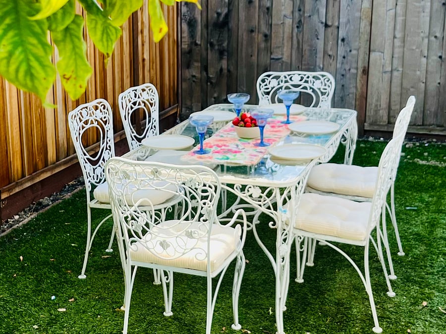 Outdoor table and chairs to enjoy margaritas and meals outside.