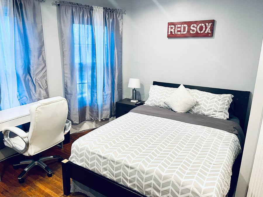 Bedroom 2. Queen size bed, with TV, dresser and night stand, desk and office chair. Nice sized walk-in closet with shelving. Full motion mounted TV with premium cable and smart app access.