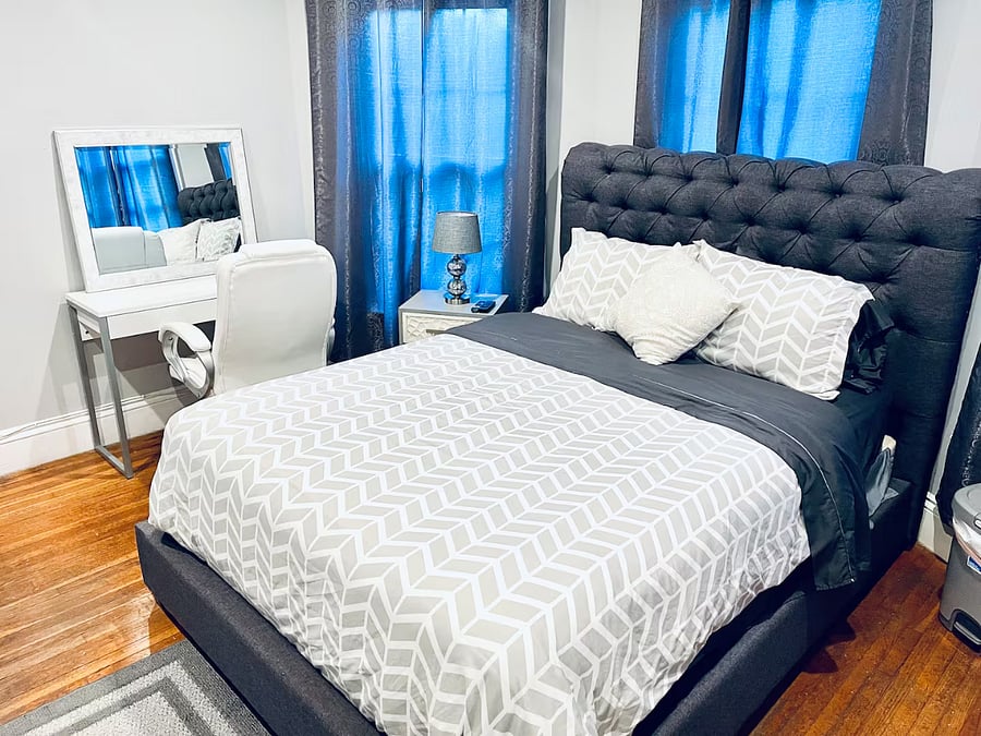 Bedroom 3. Queen size bed, with TV, dresser and night stand, desk and office chair. Nice sized closet with shelving. Full motion mounted TV with premium cable and smart app access.