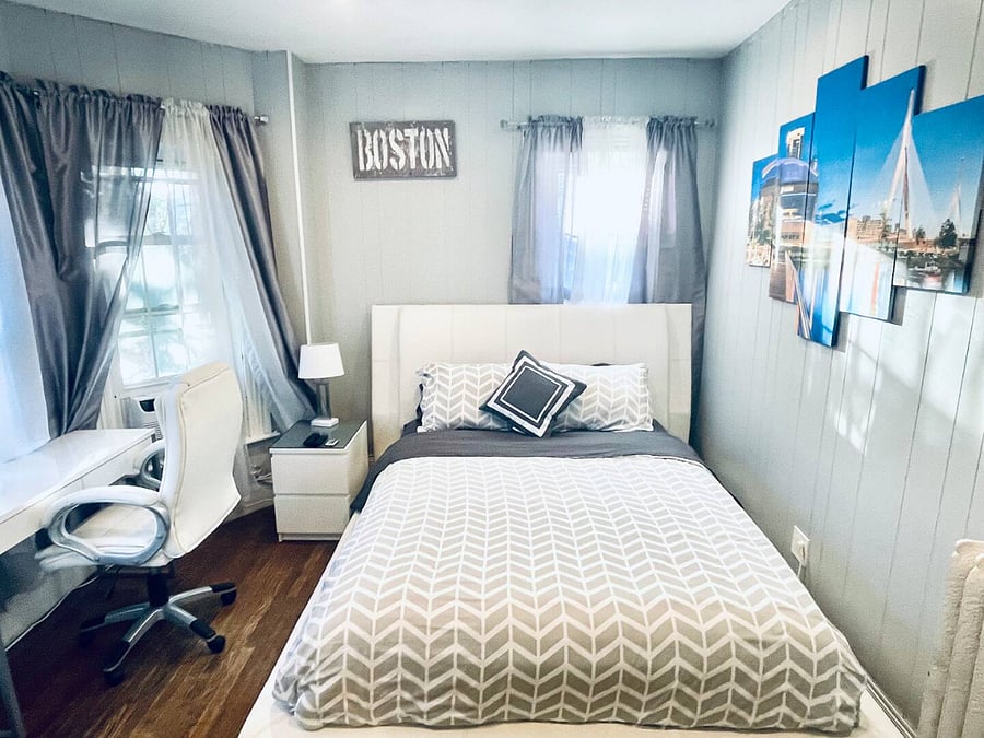 Bedroom 1. Queen size bed, with TV, dresser and night stand, desk and office chair. Including a walk in closet. Full motion mounted TV with premium cable and smart app access.