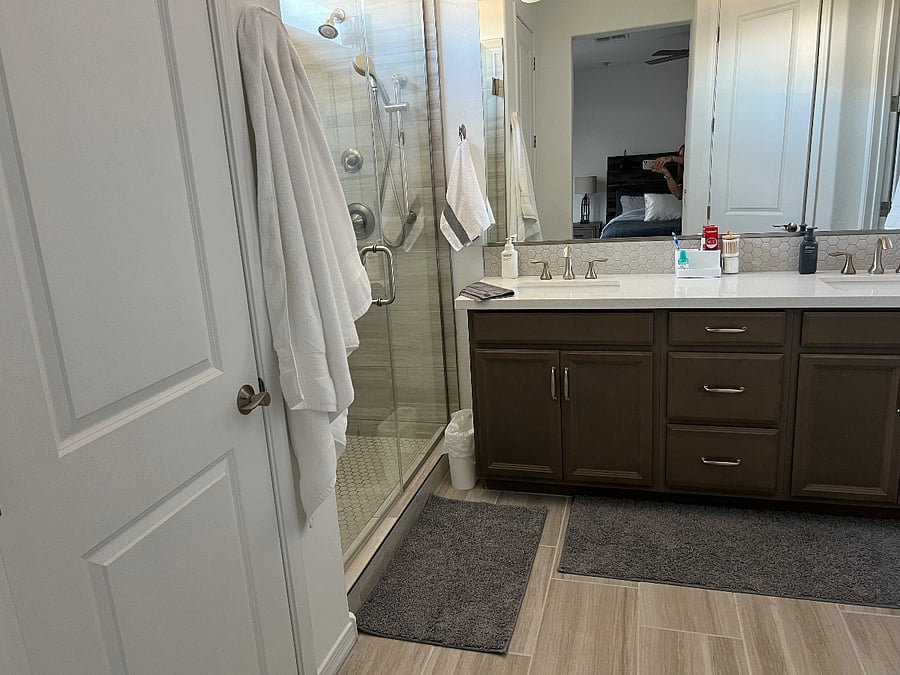 Spa-like master bath with dual sinks, huge shower with multiple shower heads, and spacious closet