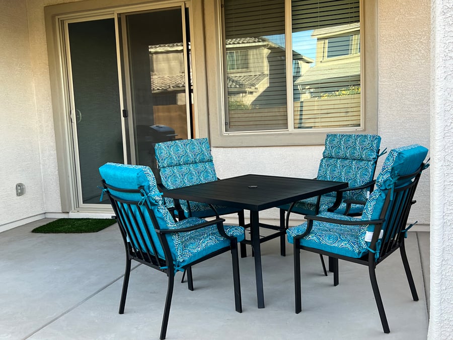 Outdoor dining area with comfy chairs