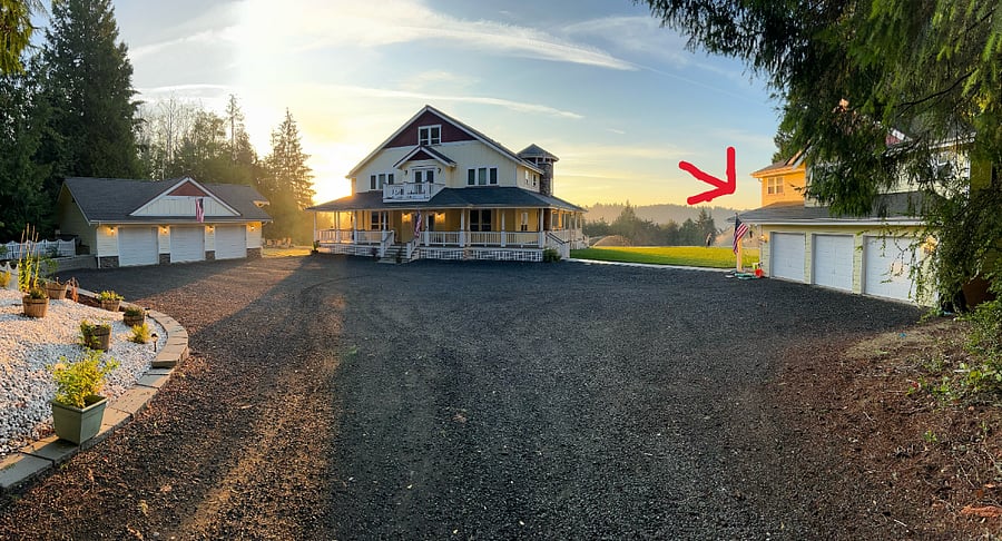 Owners live in the main house. The guesthouse is above the three-car garage to the right of the house. 