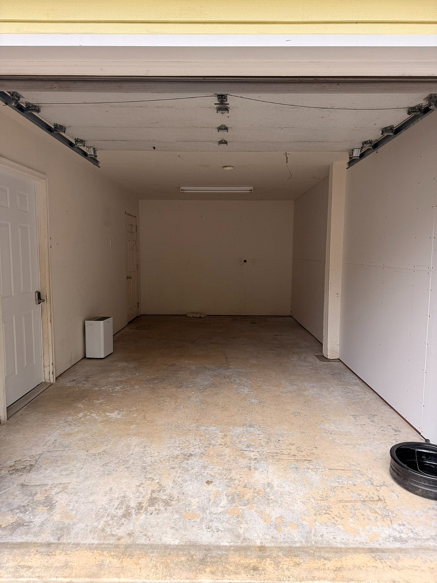 A large garage stall can accommodate a vehicle and still leave room for some storage. 