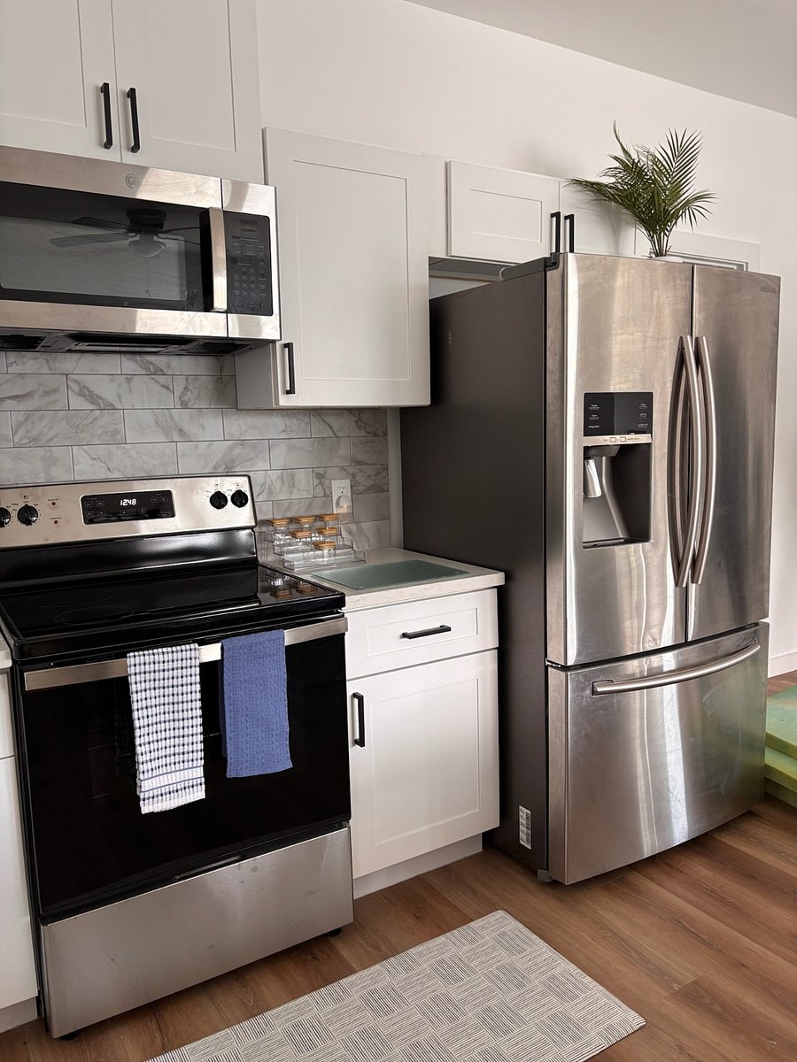 Kitchen is equipped with stainless steel appliances.