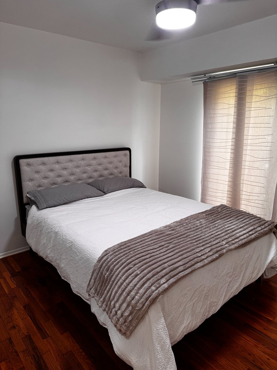 Master bedroom with access to backyard patio.