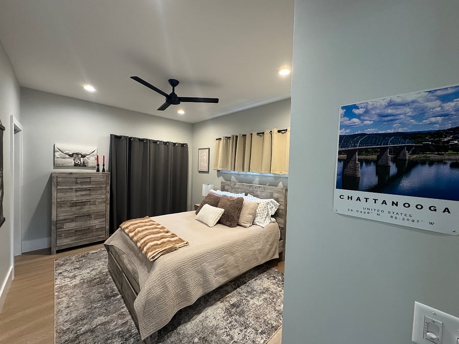 Cozy bedroom with memory foam queen bed, blackout curtains and balcony 