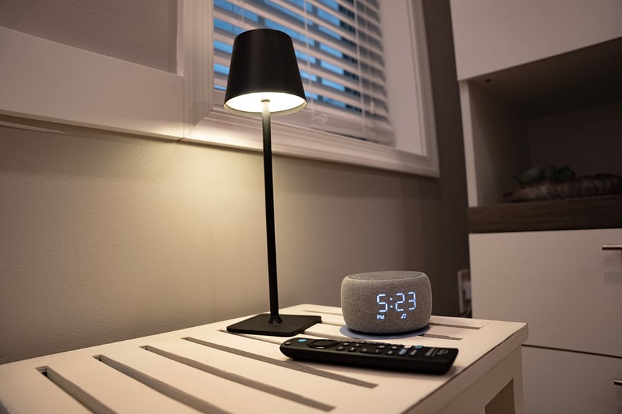 Side table with lamp and "sleep machine" for deep slumber.
