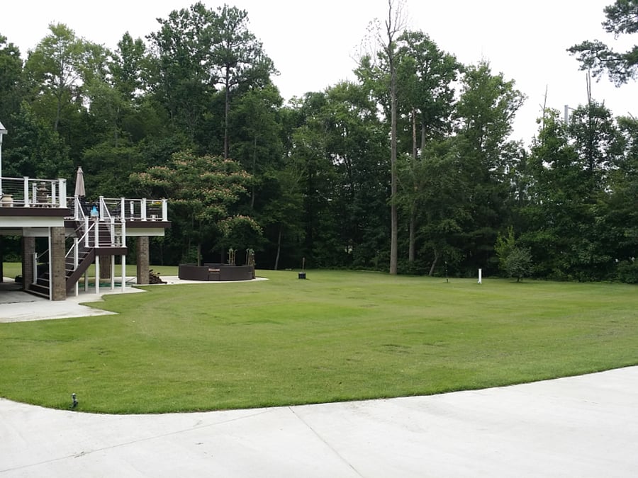 Large Zoysia grass area for that outdoors feeling without being in the woods. Covered deck for relaxation outside during those storms.