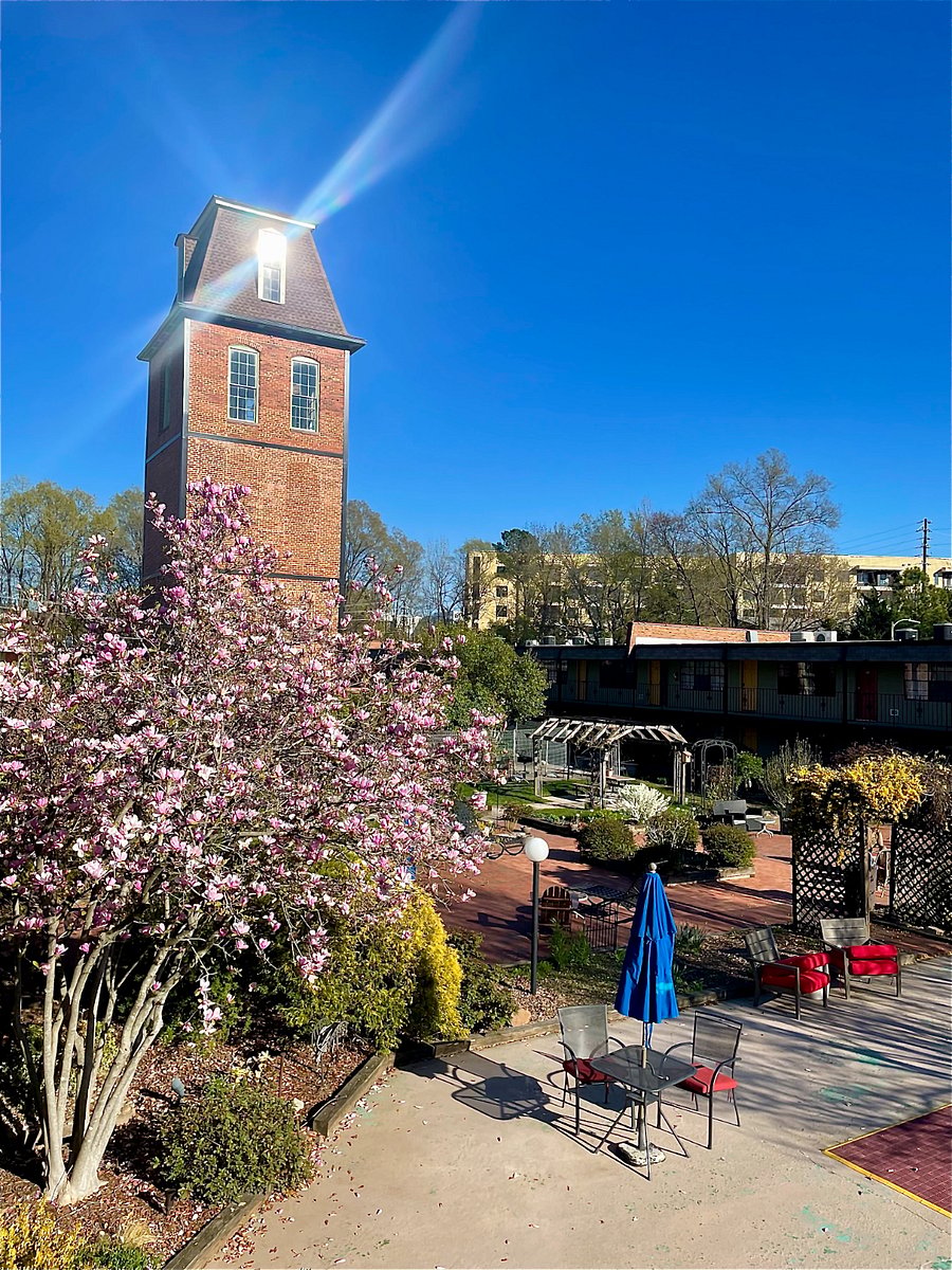 Lovely well-maintained courtyard around the historic tower from the original Pearl Mill textile factory.