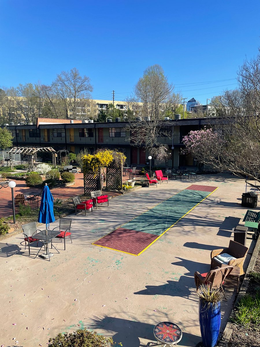 Lovely well-maintained courtyard with games and seating areas.