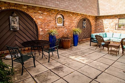 Lovely well-maintained courtyard with multiple comfortable seating areas.