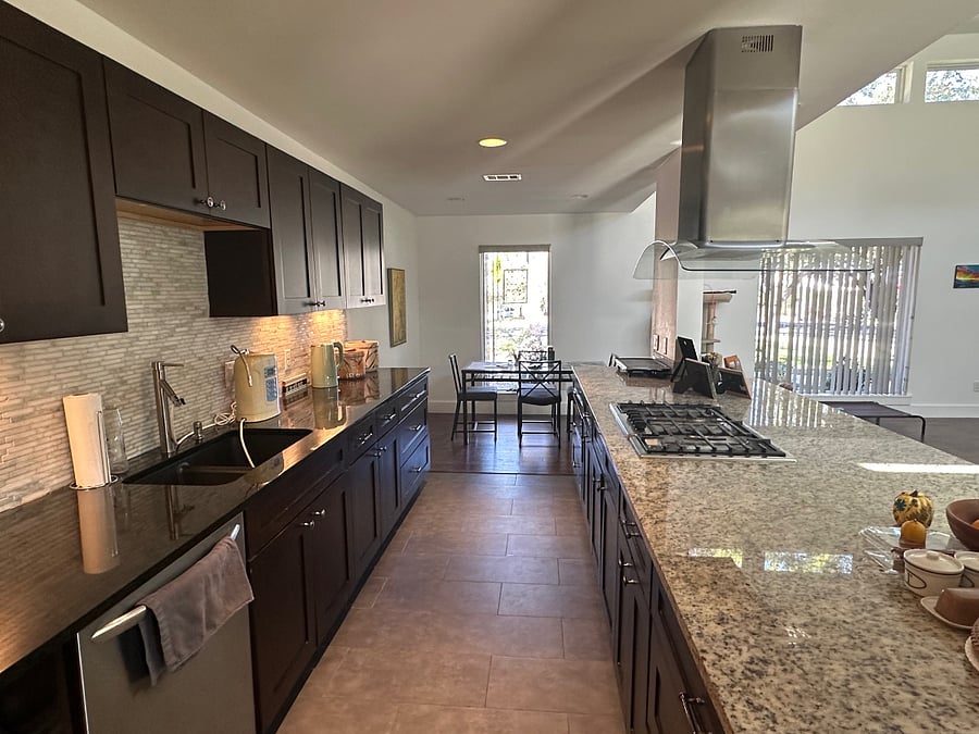 Shared kitchen with stainless appliances, granite counters and tons of cabinet space