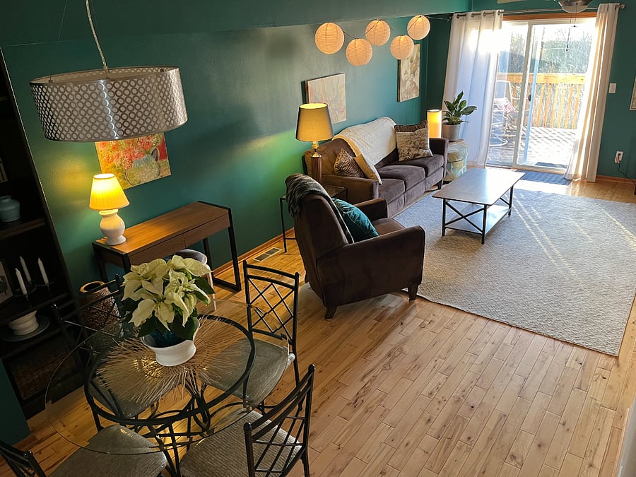 The dining and living room are a warm vibe to unwind in after a long day at work.