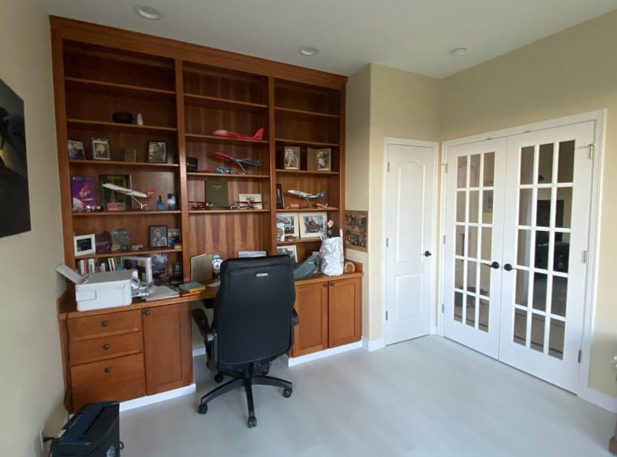 Office that has a couch with chaise and folds out into a queen size bed