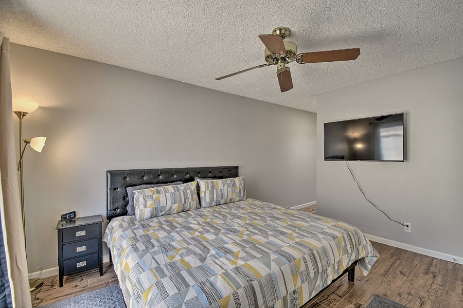 Master bedroom with big screen TV. 
Ma