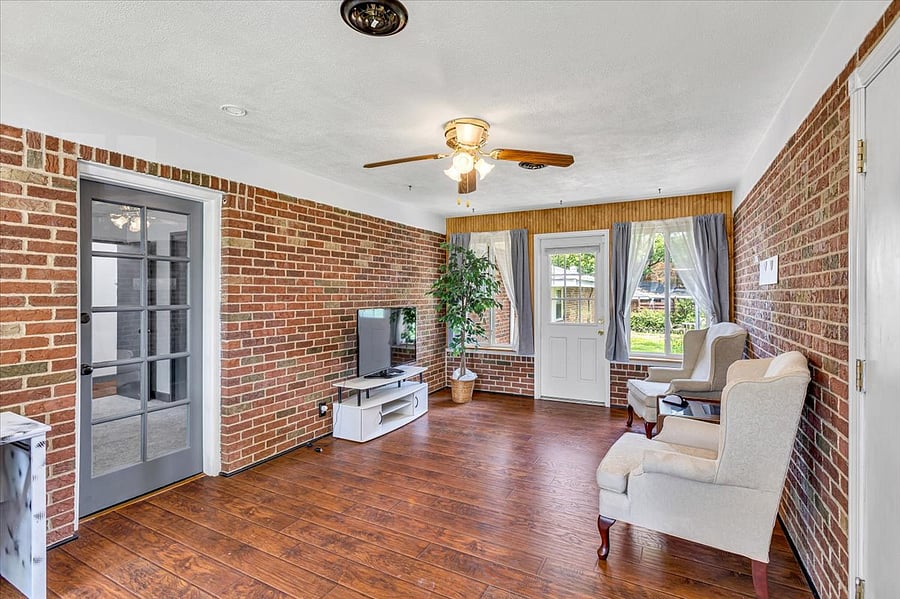 Sunroom with desk, tv and couch