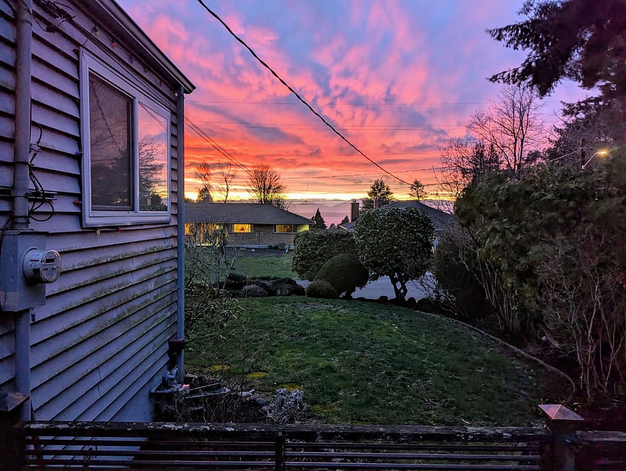 One of a million amazing sunsets. Green growth on house has since been removed.