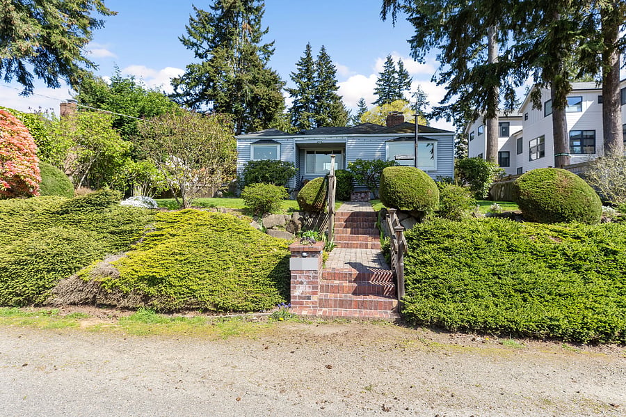 Front of the house from the street. Brick stairway and beautiful landscaping