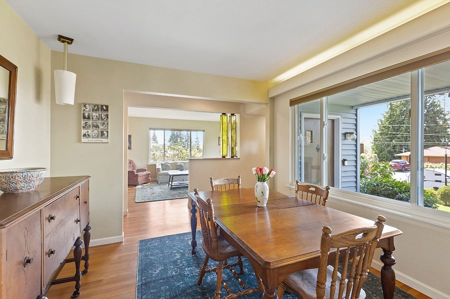 Dining room with view into living room and out to the west