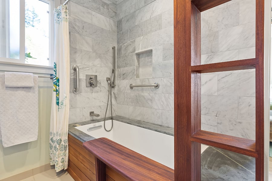 Primary bathroom with 3 way shower and tub. Rain shower, handheld shower and deep bathtub