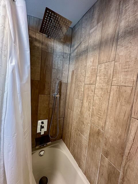Bathroom has soaking tub and rain shower. 