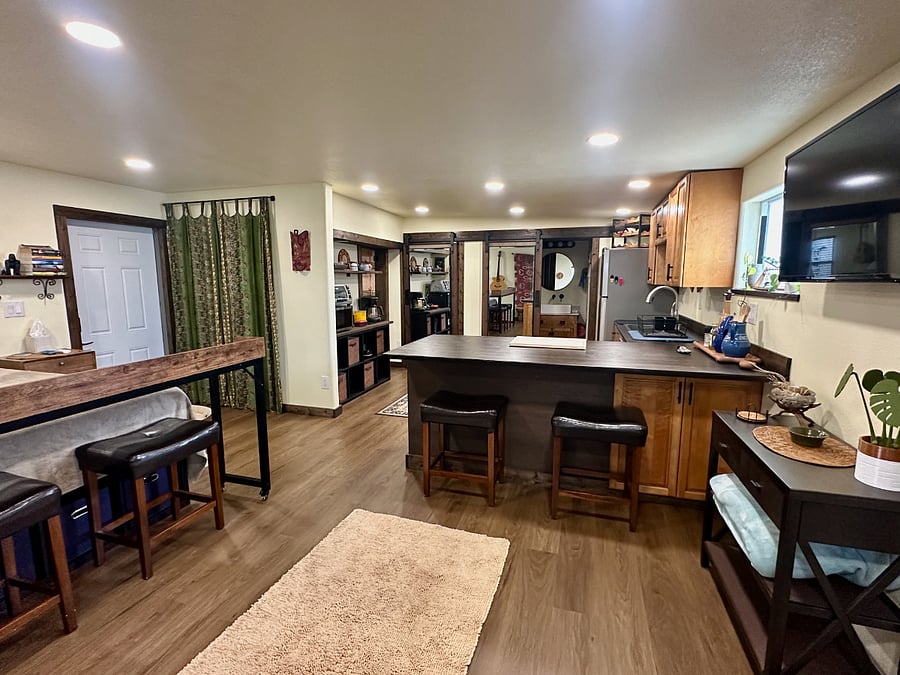 View of the apartment from the L-shaped couch. 
