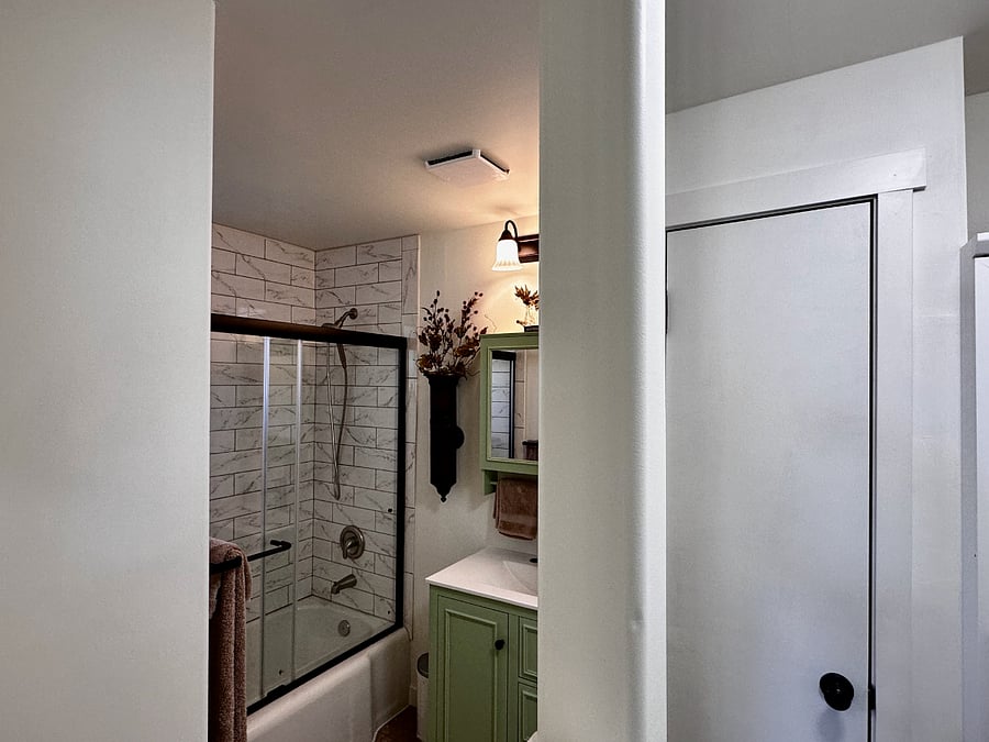 Well lit bathroom with great storage for your bathroom items.