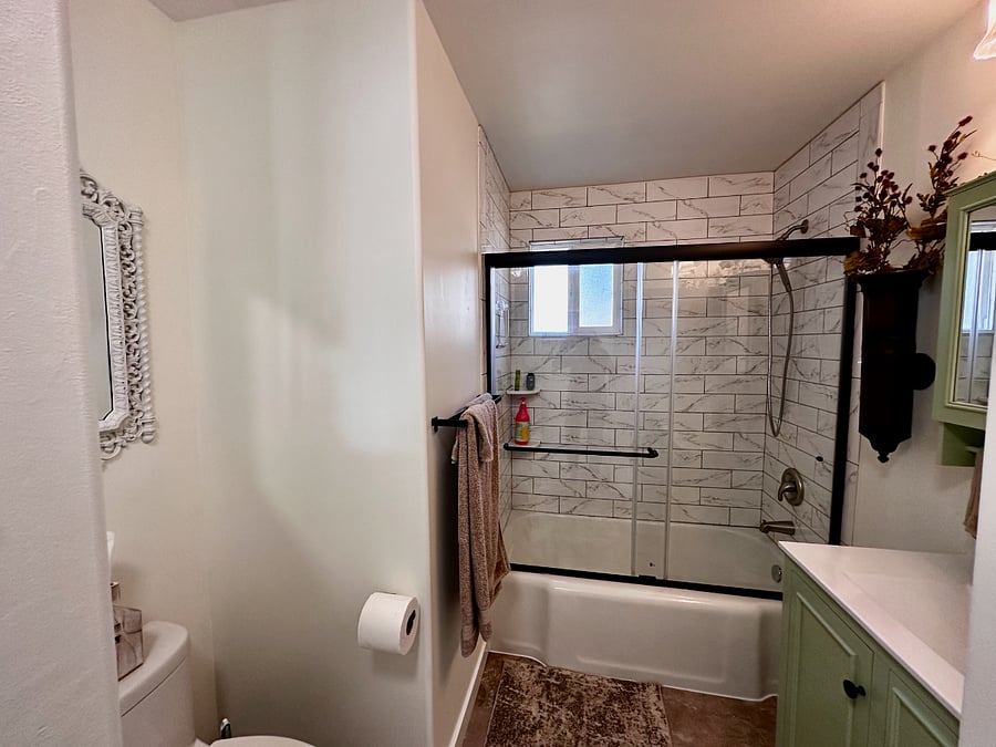 Bath tub for soaking or room for a shower.