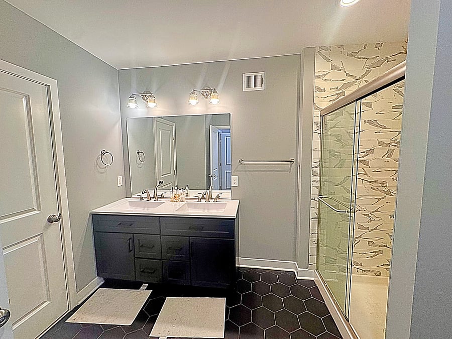 Start and end your day in style- your private bathroom features a double vanity and sleek glass walk-in shower