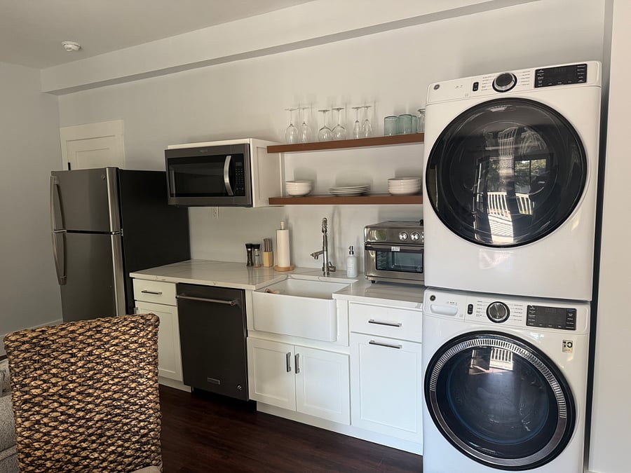All new: w/d, over the range microwave, fridge, fully functional countertop oven with digital controls and air fryer setting, 2 burner cooktop, dishwasher